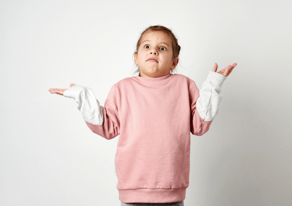 young girl looking confused shrugging